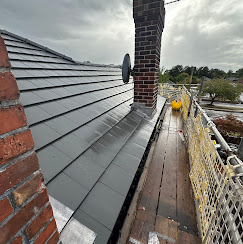 Slate roof with lead flashing and chimney