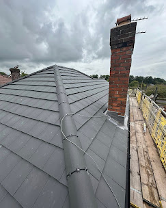 Slate roof with chimney repair complete
