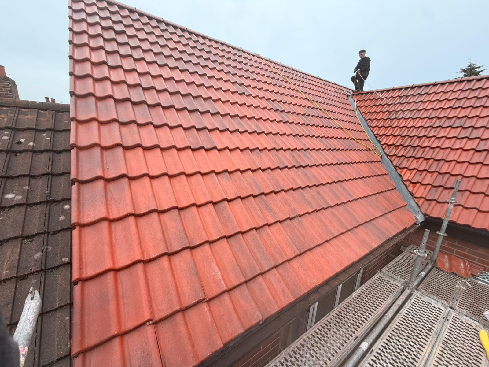Re-roof in progress with new red clay tiles
