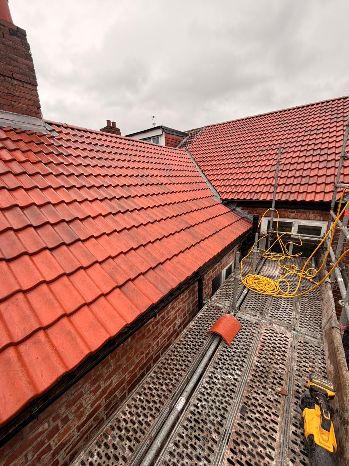 Completed red tile pitched roof